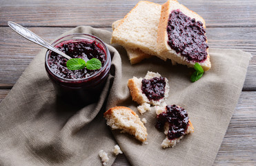Delicious black currant jam on table close-up