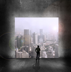 man looking at skyscrapers