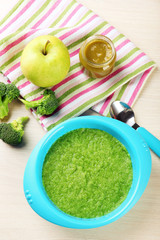 Fresh baby food in bowl with spoon