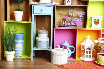 Beautiful colorful shelves with different home related objects