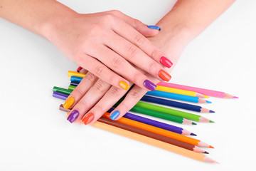 Naklejka premium Multicolor female manicure with colored pencils isolated