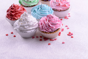 Delicious cupcakes on table close-up