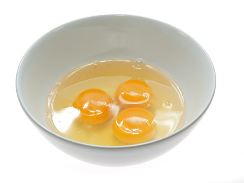 cracked fresh eggs in a bowl