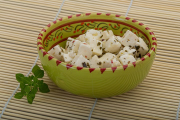 Cheese with spices and oil