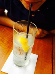 sipping a glass of water through a straw