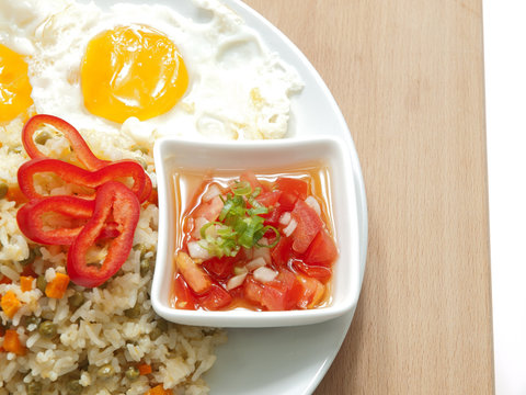 fried rice, fried eggs, fresh tomatoes & onions