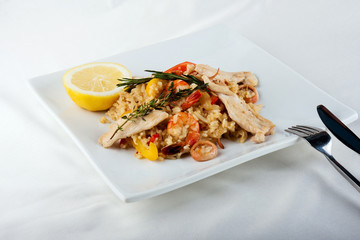 The plate with Paella in restaurant - spanish dish with sea food