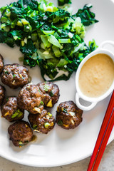 Meatballs with green salad and honey mustard sauce