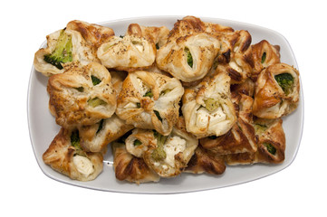 plate with broccoli and white cheese cookies