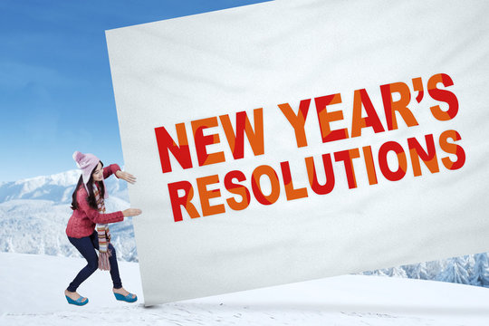 Student With A Resolutions Banner