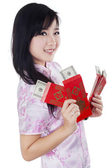 Teenage girl with money dollars cash in envelope