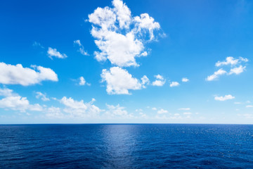 Naklejka na ściany i meble Seascape. Blue sky and white cloud.