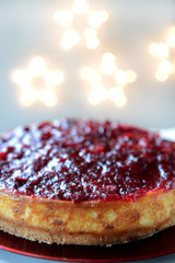 Cranberry Vanilla Cheesecake with Lights on Background