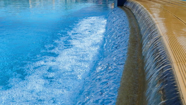 water splashing down into a pool 
