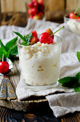 Rice pudding with berries in glass jars. breakfast
