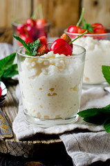 Rice pudding with berries in glass jars. breakfast
