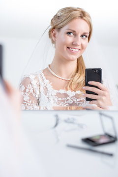 Beauty bride taking photo of herself
