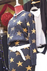 Body mannequins wearing clothes for sale.