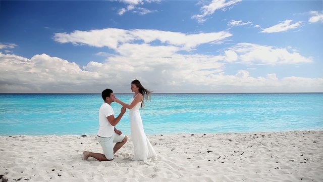 Young beautiful newlyweds doing  pledge of allegiance on white s