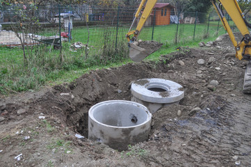 Excavator digging a hole