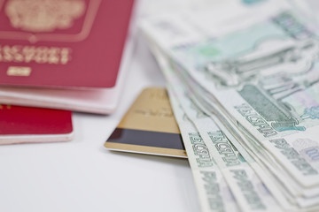 passport, large banknotes and gold credit card