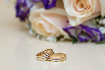 Beautiful wedding bouquet and wedding rings 