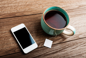 Cup of tea and phone in office
