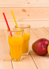 Mango juice with mango in the closeup.