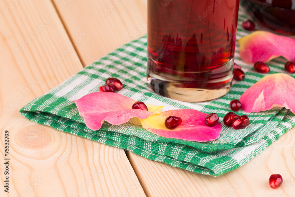 Poster Glass of pomegranate juice and grains.