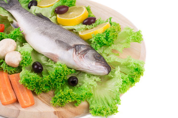 Composition of fresh seabass and vegetables.