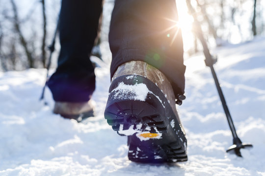 Winter hiking. Lens flare, shallow depth of field.