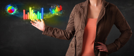 Young businesswoman touching colorful modern graph system concep