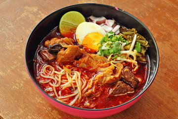 close up thai northern spicy pork noodle in cup