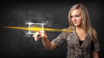 Young tech lady touching button with orange light beams concept