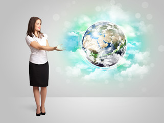 Young woman with earth and cloud concept