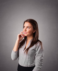 Young woman standing and thinking with copy space