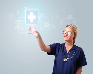 Young nurse pressing modern medical type of buttons