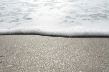 Wave of the sea on the sand beach