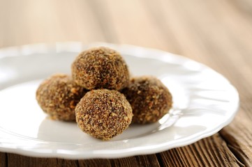 Homemade almond candies on white plate
