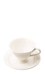 Ceramic saucer and teacup over white background 