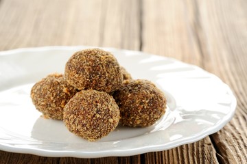Homemade almond candies on white plate