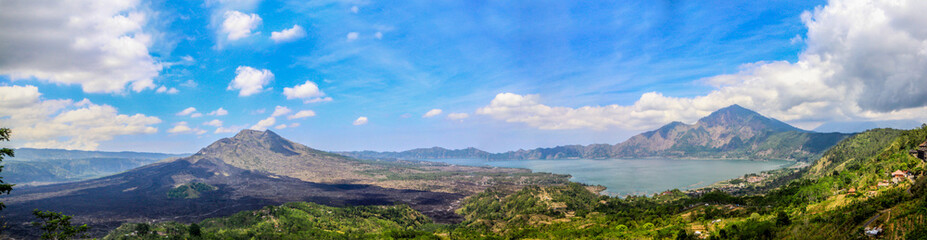 Obraz premium Volcano of Batur at sunny day surrounded by green valley. Bali,