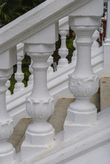 Outside stairs and white stone handrail