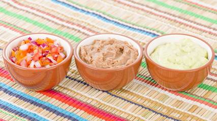 Mexican Dips & Side Dishes - Salsa, Guacamole and Refried Beans.
