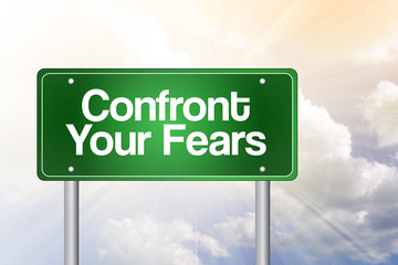 Confront Your Fears Green Road Sign, business concept