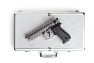handgun on aluminium case