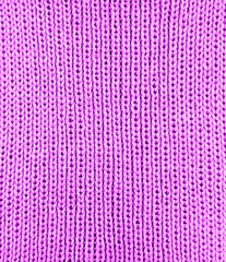 Pink knitting wool texture background.
