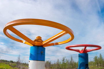 Two gas valve against the sky