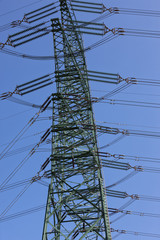 Electricity pylon against blue sky