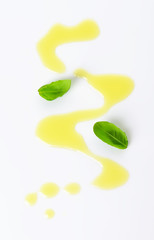 Olive oil drizzle and basil leaves